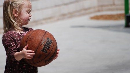 blond little girl with basketball ball